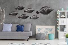 Grey home interior with nautical wall decor sofa carpet and white storage unit