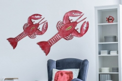 Teddy bear on blue pouf and white cradle in bright kid's bedroom with lamp, carpet and armchair